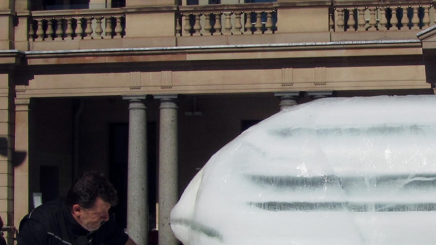 The 10-tonne block was carved to raise awareness of global warming.