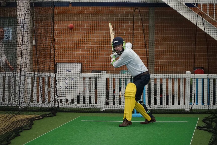 Patrick Galloway bats in the nets against Mitchell Starc