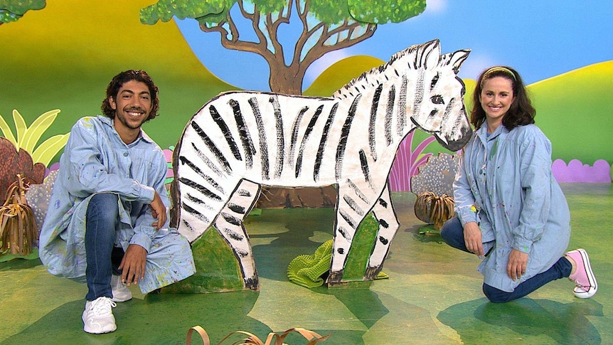 Hunter and Emma with a zebra prop