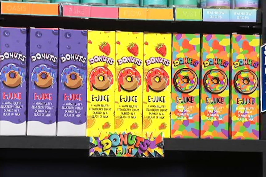 Colourfully packaged e-cigarette vaping products - E-Juice Pancake flavour - on a shelf in a store.