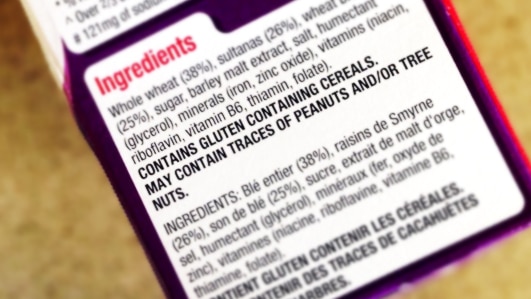 Cereal package listing ingredients and health warnings.