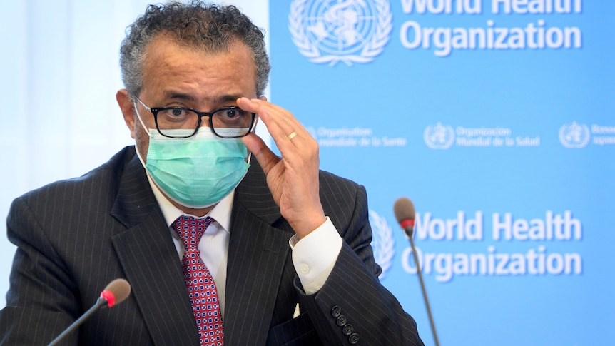 Tedros Adhanom Ghebreyesus wearing a surgical mask while appearing at a press conference.