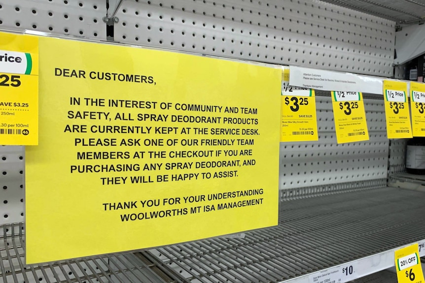 A sign on empty shelves in a supermarket.