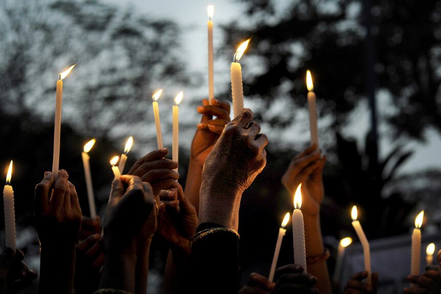 Candles held during a vigil in Kolkata, India, for a gang-rape victim.