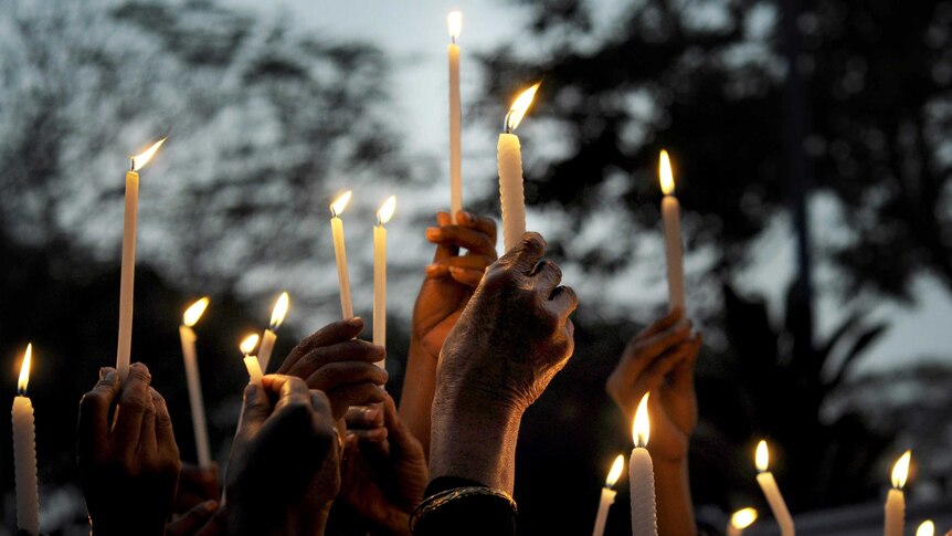 Candles held during a vigil in Kolkata, India, for a gang-rape victim.