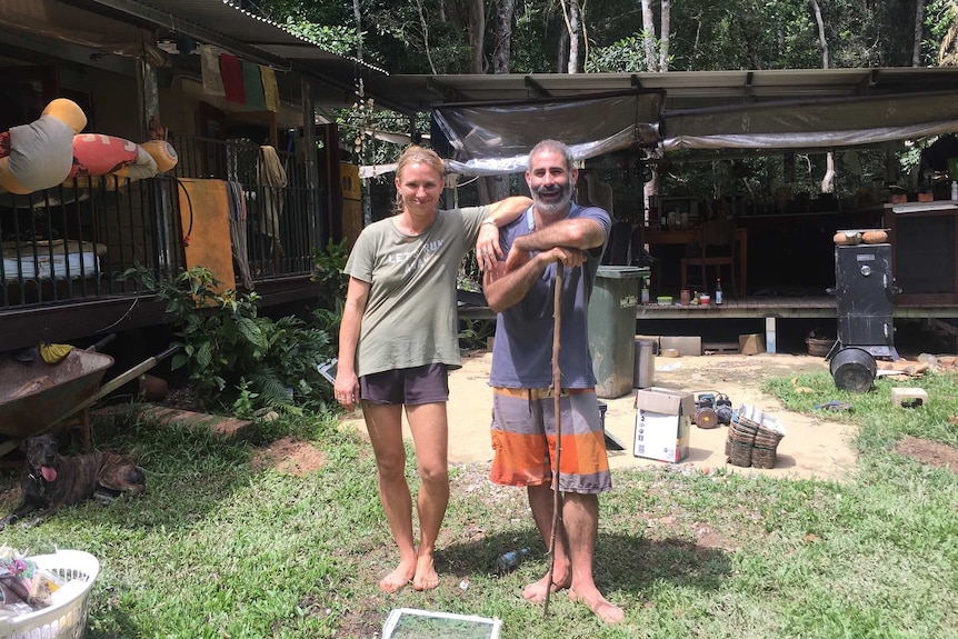 Kalu Davies and Stu Biggs outside their home which was flooded on the March 27, 2018.