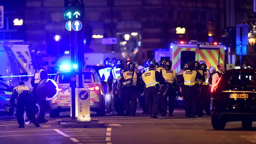 Police attend to an incident on London Bridge in London.