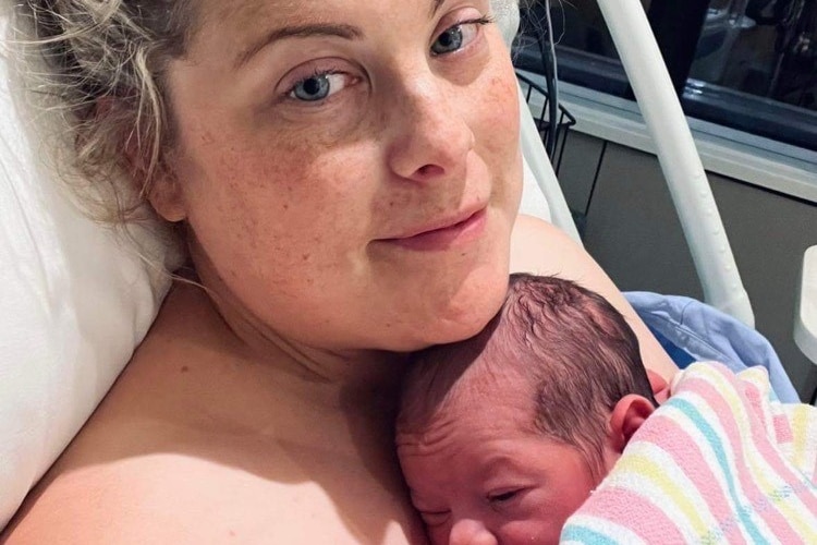 Rebecca with newborn baby in hospital