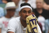 Nick Kyrgios looks on during Wimbledon loss to Andy Murray