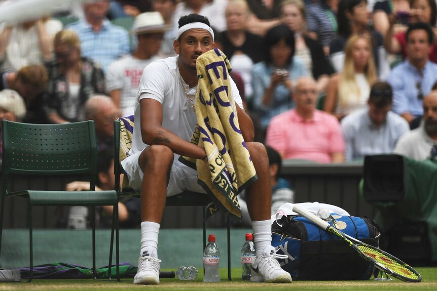 Nick Kyrgios looks on during Wimbledon loss to Andy Murray