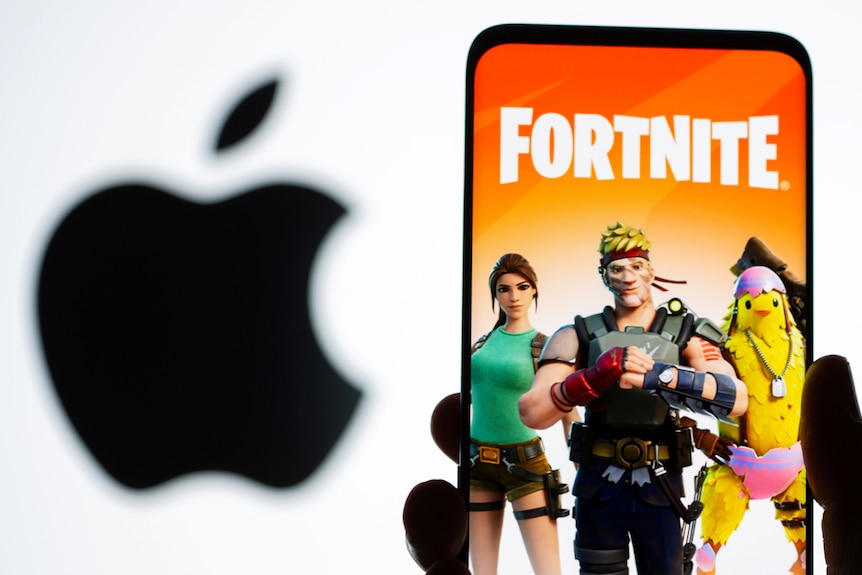 Fortnite graphic on a phone in front of the apple logo