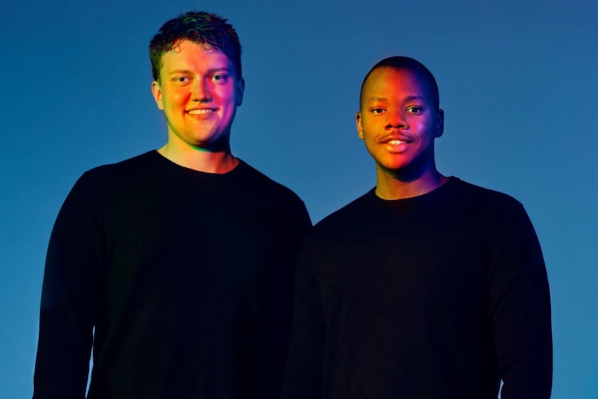 two young men wearing black jumpers in computer image 