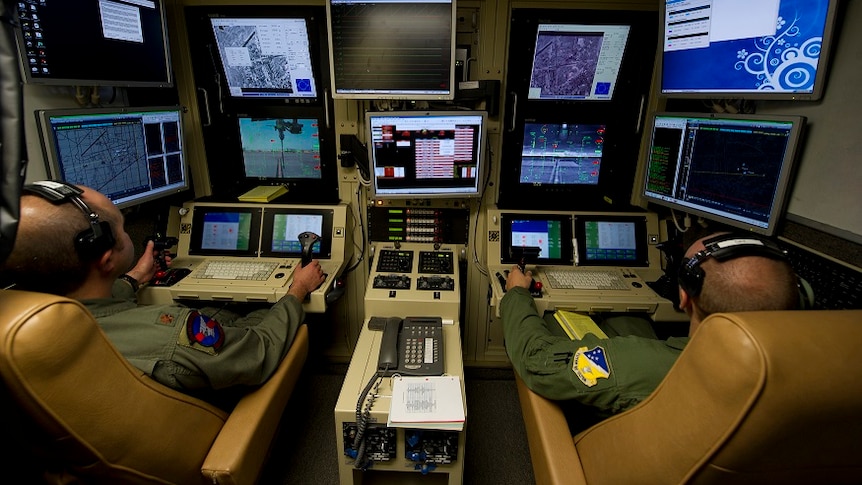 Drone operators fly an MQ-9 Reaper training mission from a ground control station at Holloman Air Force Base, New Mexico.