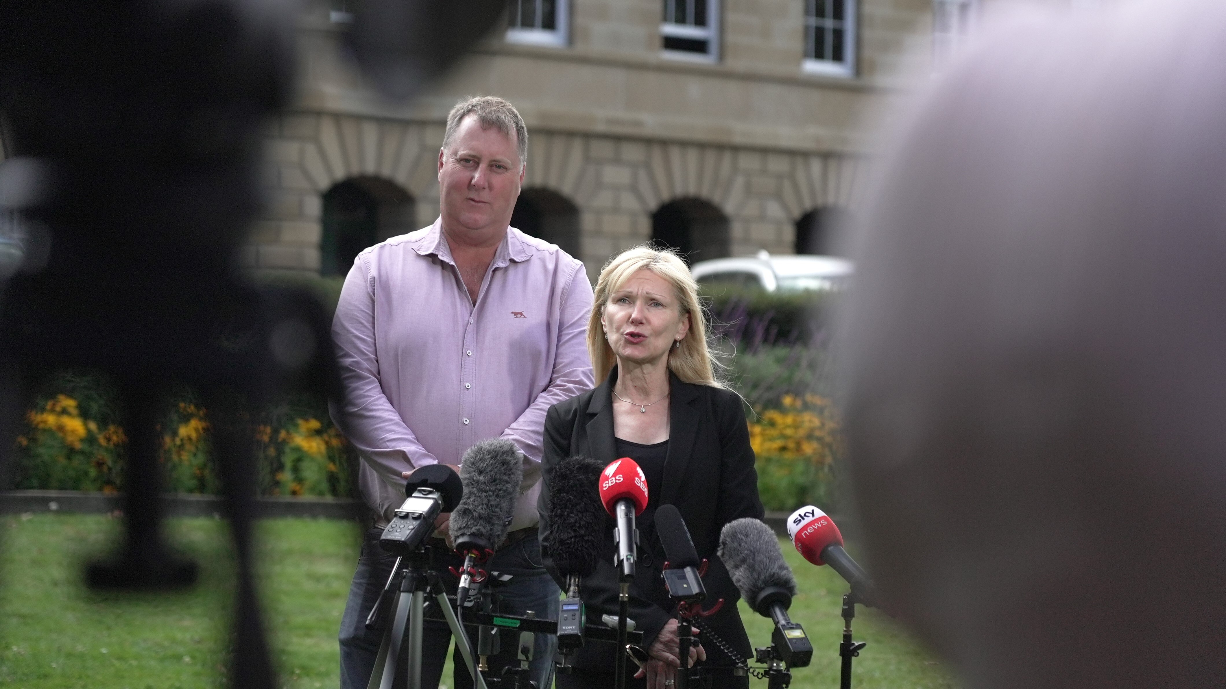 John Tucker and Lara Alexander speak to media.