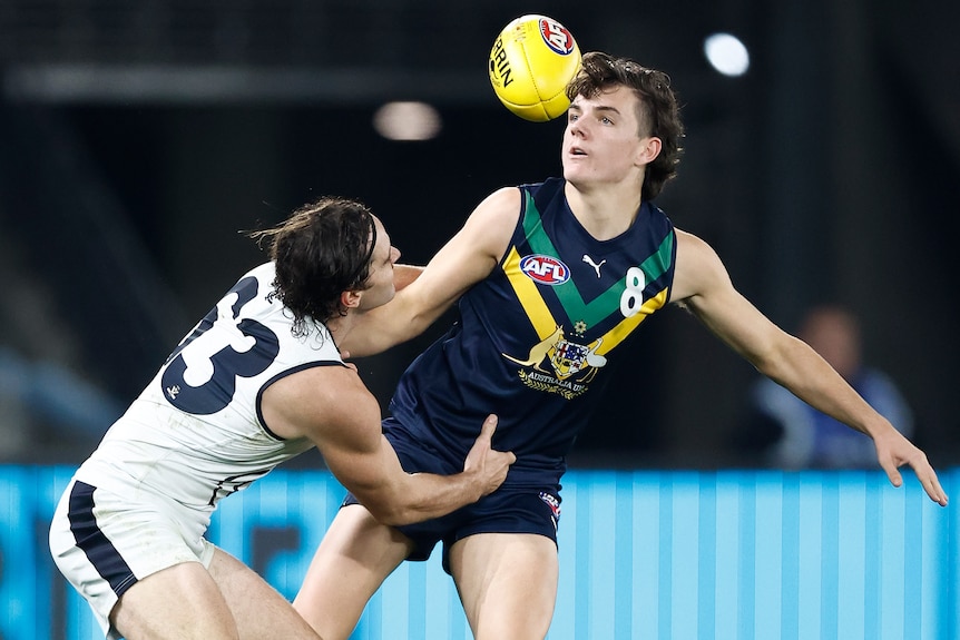 Archie Roberts is tackled while playing for the AFL Academy