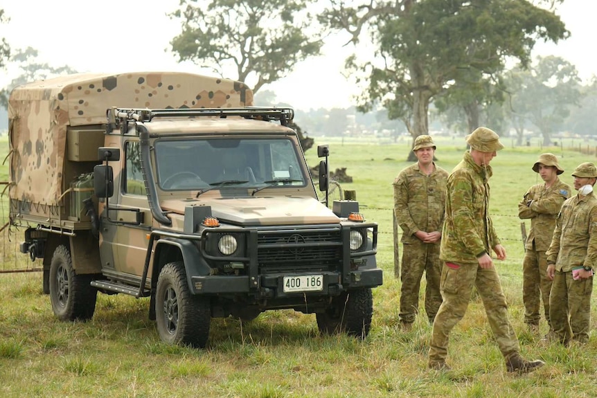 Australian Defence Force personnel with an ADF truck parked in South Australia's south-east
