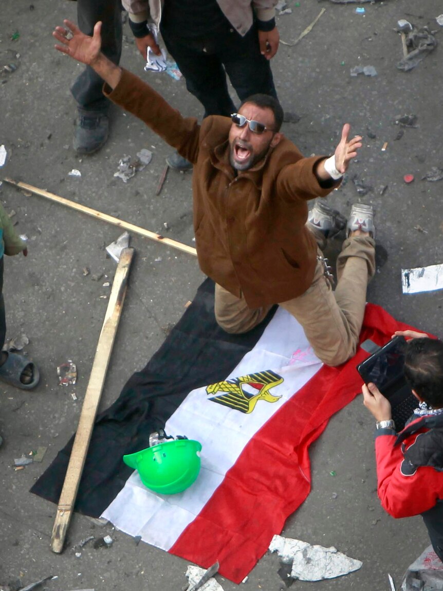 A protester shouts slogans during clashes at Tahrir Square in Cairo.