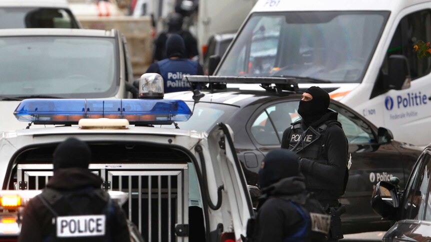 Belgian police stage a raid after the Paris attacks