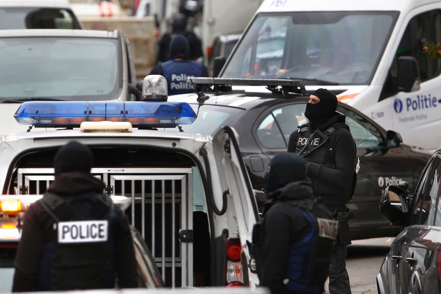 Belgian police stage a raid after the Paris attacks