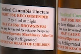 Labels on two vials of medicinal cannabis.
