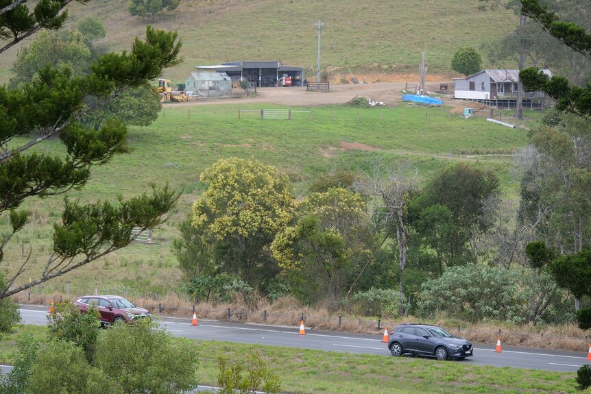 A distant image of a farm house near a road in northern New South Wales.