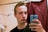 Murder-accused Mark Daniel Ferguson taking a selfie with his mobile in a bathroom mirror.