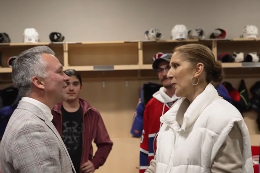 Celine Dion smiles at Montreal Canadiens head coach Martin St-Louis