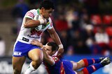 Pelo evades a tackle against the Knights