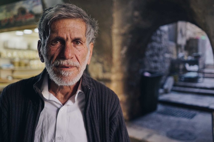 Amus Duitch stands outside the bazaar during the evening in jerusalem