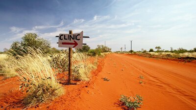 File photo: A sign points to the health clinic in the Indigenous community of Utopia (Getty Images: Ian Waldie)