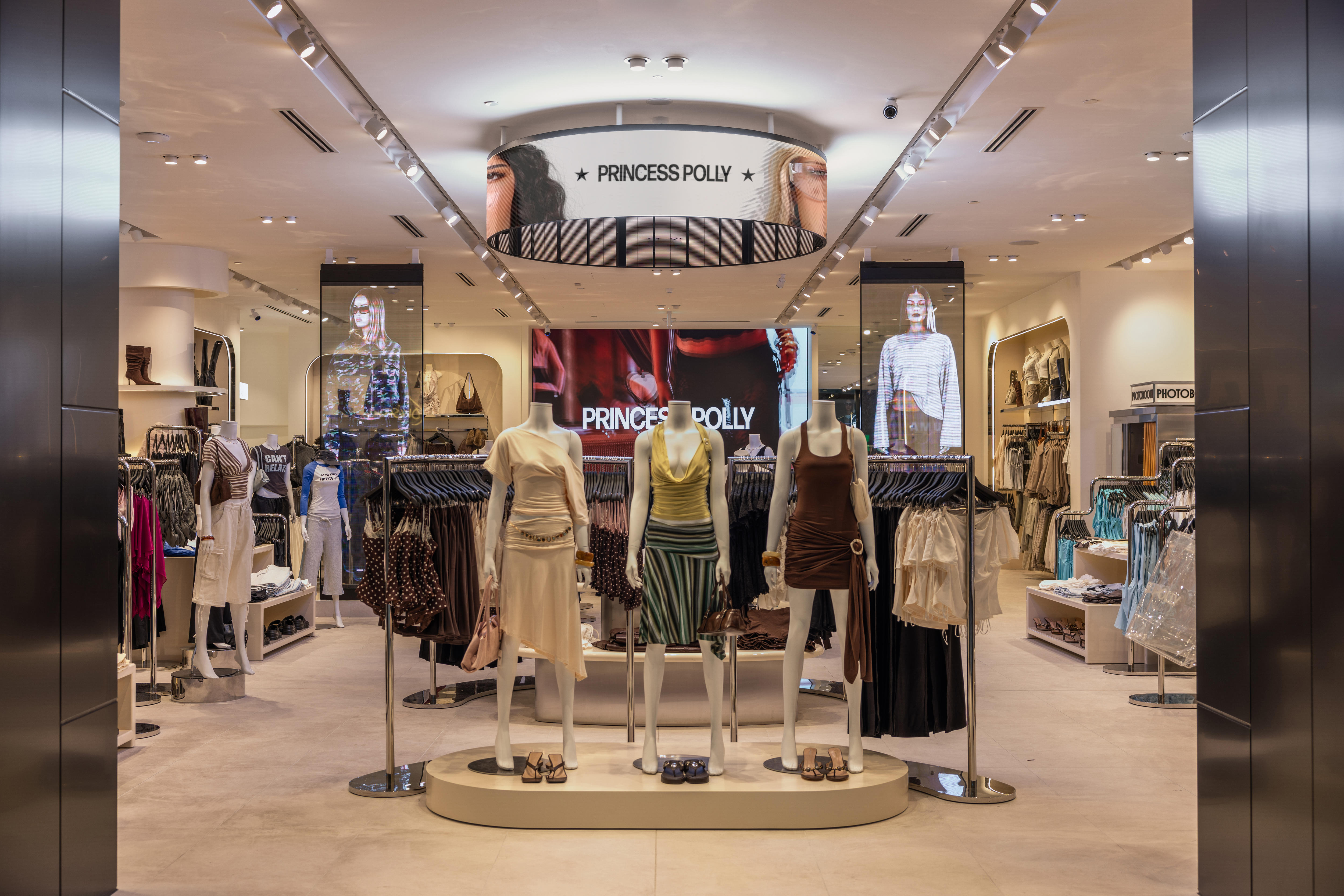 Mannequins and women's clothes inside a shop.