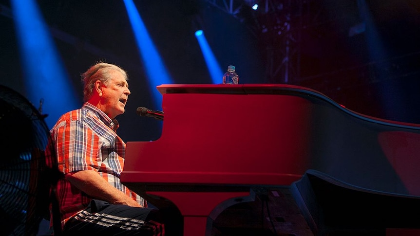 Brian Wilson sits at piano during Bluesfest performance.