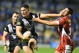 A man in black and white puts the palm of his hand in the face of an opponent