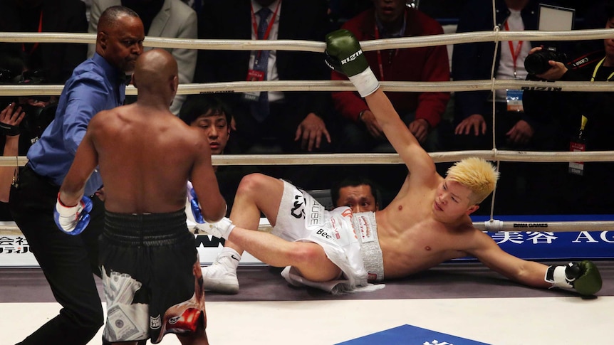 Japanese kickboxer Tenshin Nasukawa lies on the mat after being knocked out by Floyd Mayweather Jr.