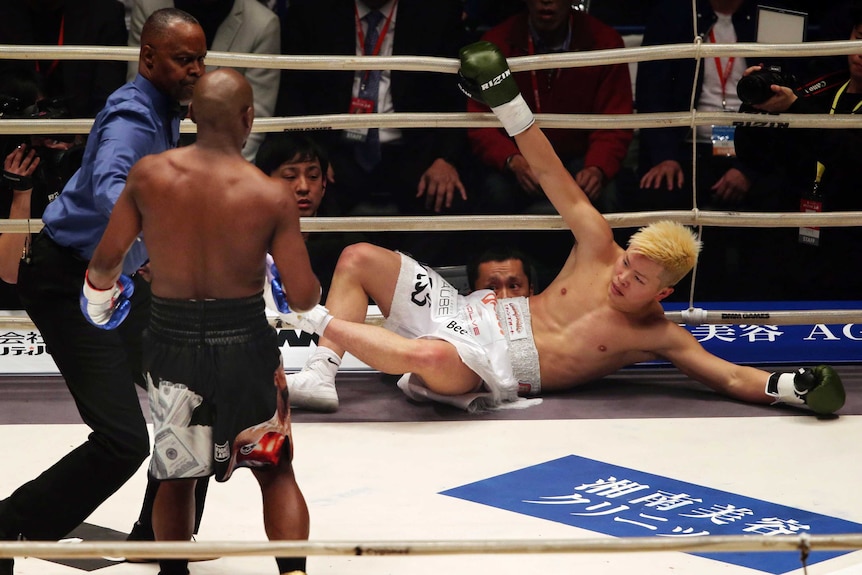 Japanese kickboxer Tenshin Nasukawa lies on the mat after being knocked out by Floyd Mayweather Jr.