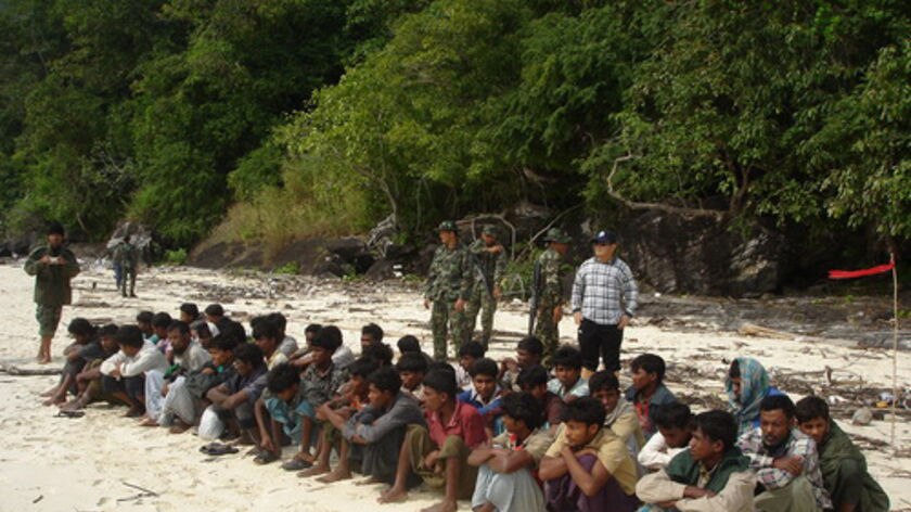 Rohingya refugees under Thai guard