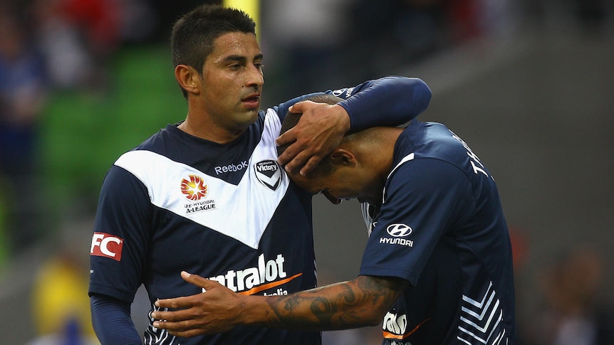 Leading light ... Archie Thompson (r) put the Victory in front as the clock ran down to half-time.