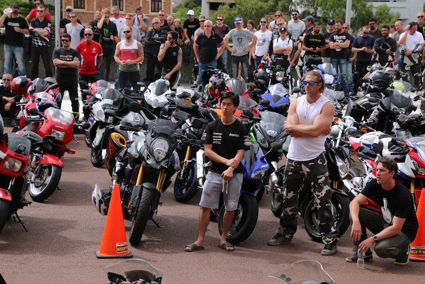 Dozens of motorcyclists and their motorbikes.