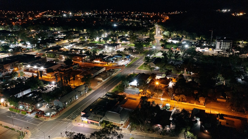 An aerial view of Alice Springs by night.