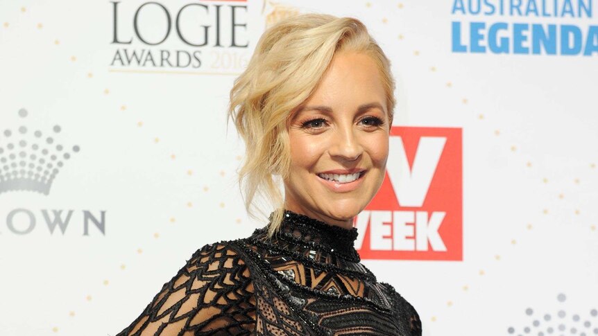 Full length photo of Carrie Bickmore on the red carpet.