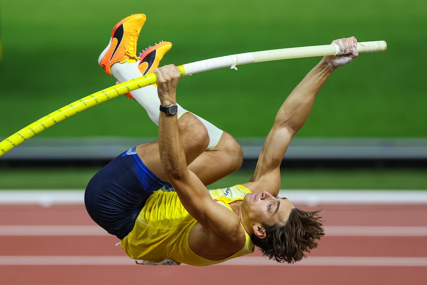 Pole vaulter Armand Duplantis launches himself off the ground in the pole vault final at the 2023 World Athletics Championships.