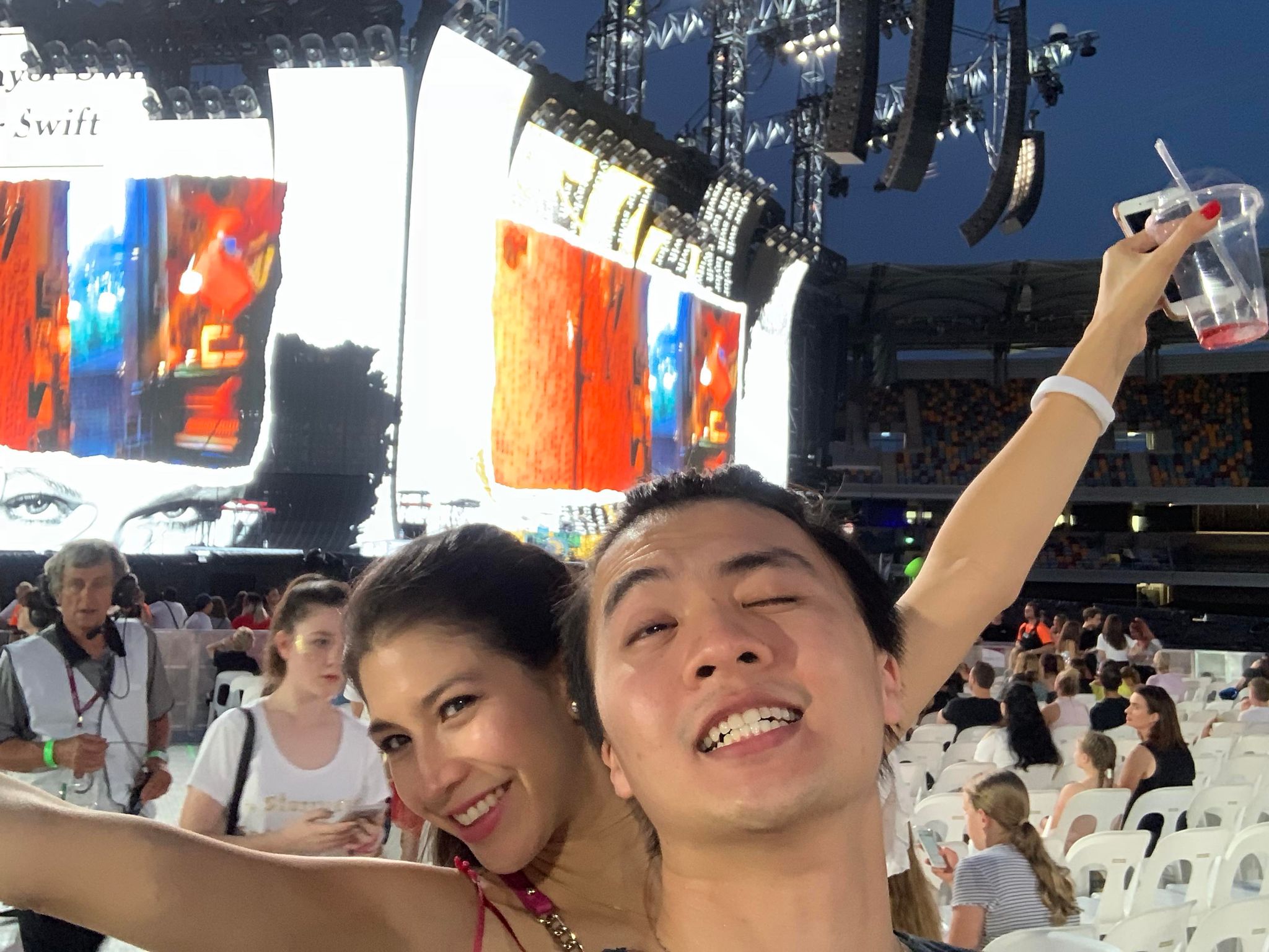A selfie of a man and a woman at a Taylor Swift concert. 