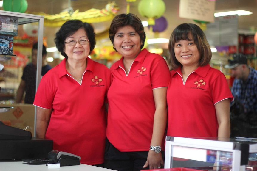 Three women in red tshirts.