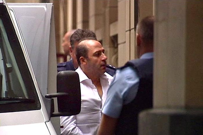 Tony Mokbel escorted from the prison van to the Supreme Court ahead of his sentence on July 3, 2012