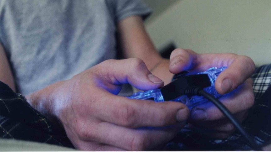 A closeup generic of a man playing video games, November 1 2005.