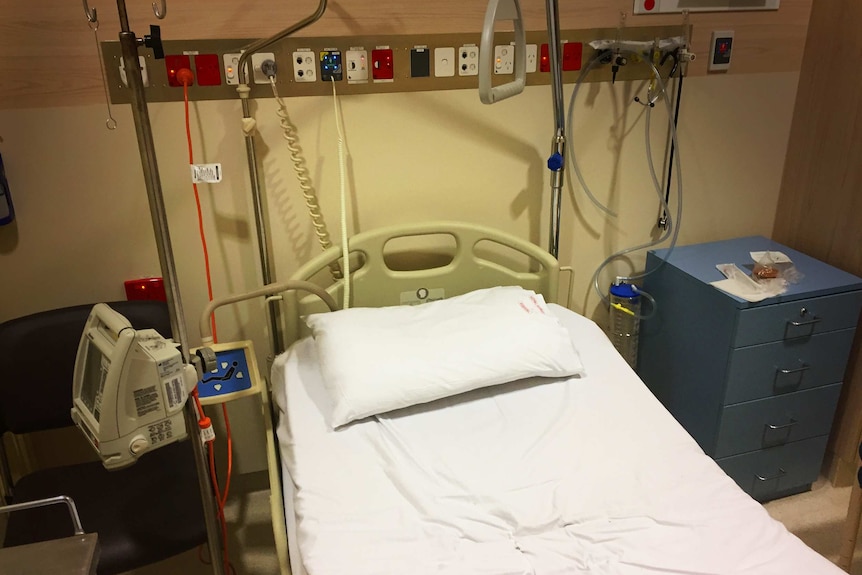 Empty hospital bed in Royal Hobart Hospital Emergency Department.