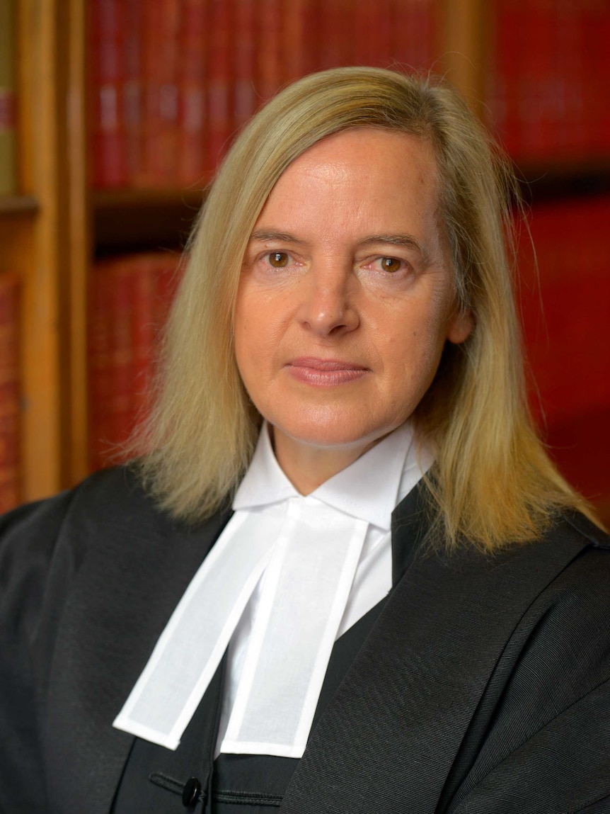 A woman wearing legal robes.