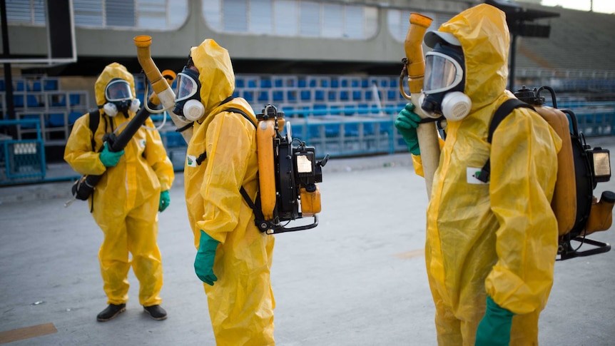 Brazilian workers spray chemicals to kill mosquitoes in Rio de Janeiro