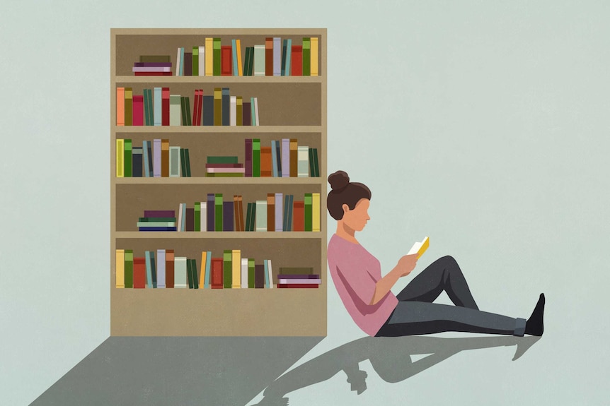 An illustration of a woman reading a book while leaning against a book case.