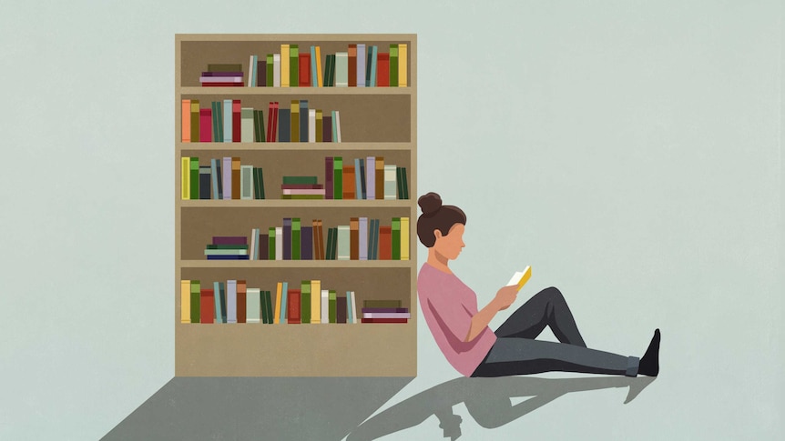 An illustration of a woman reading a book while leaning against a book case.